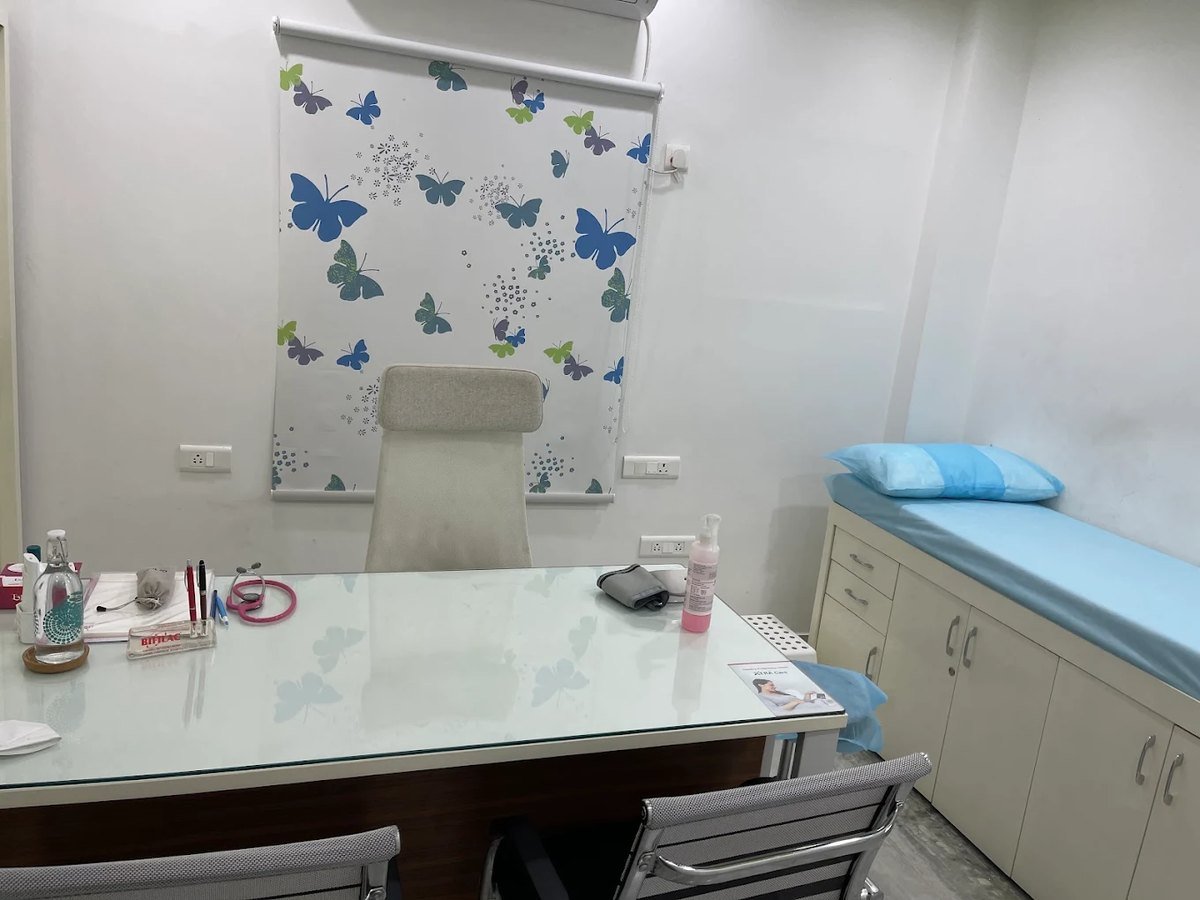 Consultation room with examination facilities at Sharada's Urban Clinic